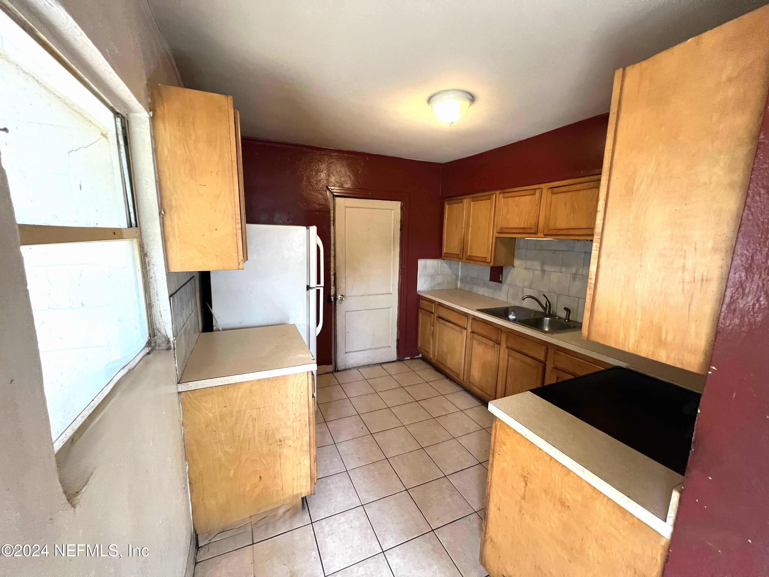 1857 Brookview Drive South Jacksonville, FL 32246 - Photo 9 of 12 a kitchen that has a sink and a stove