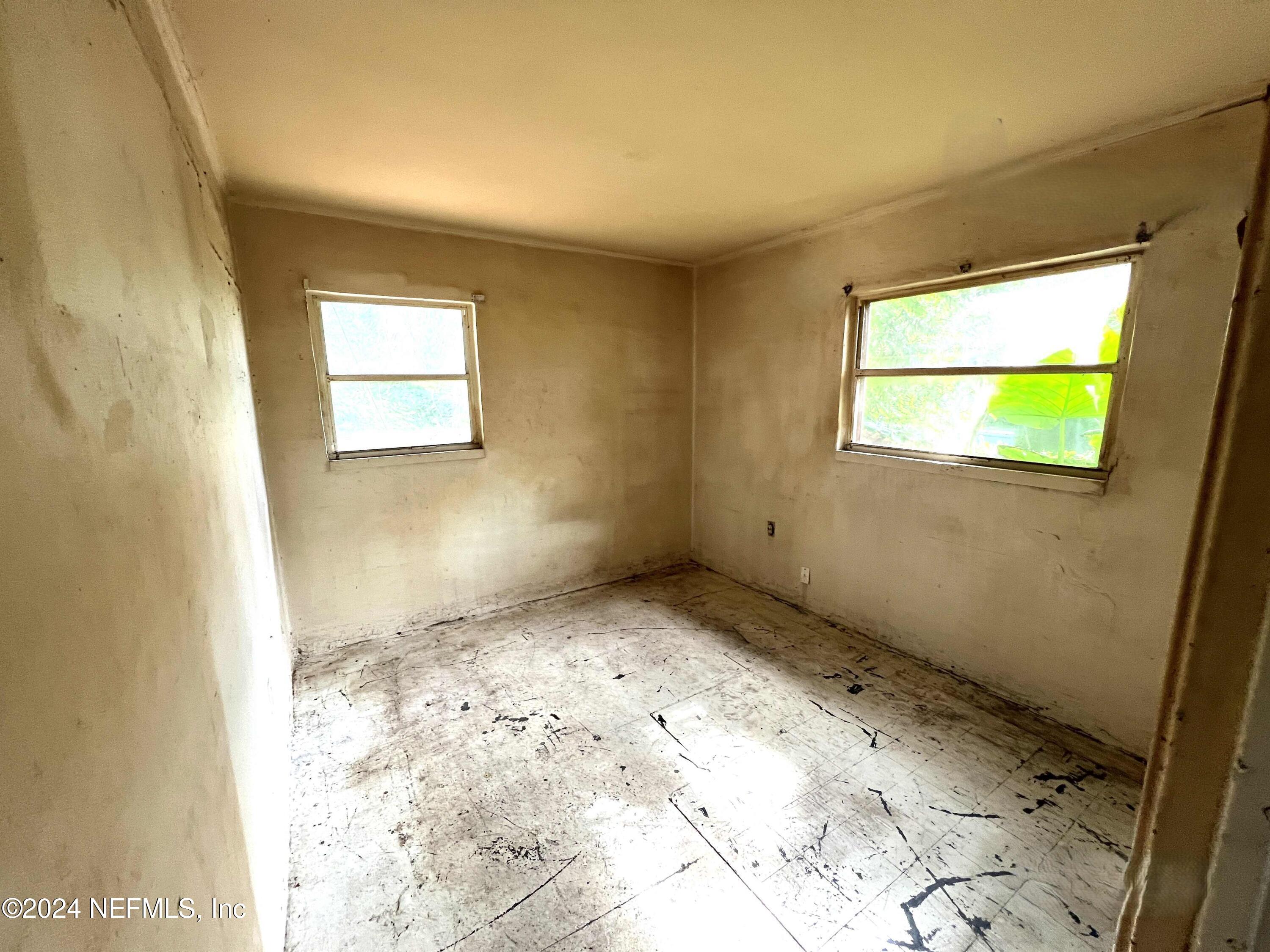 1857 Brookview Drive South Jacksonville, FL 32246 - Photo 10 of 12 a view of an empty room and a window