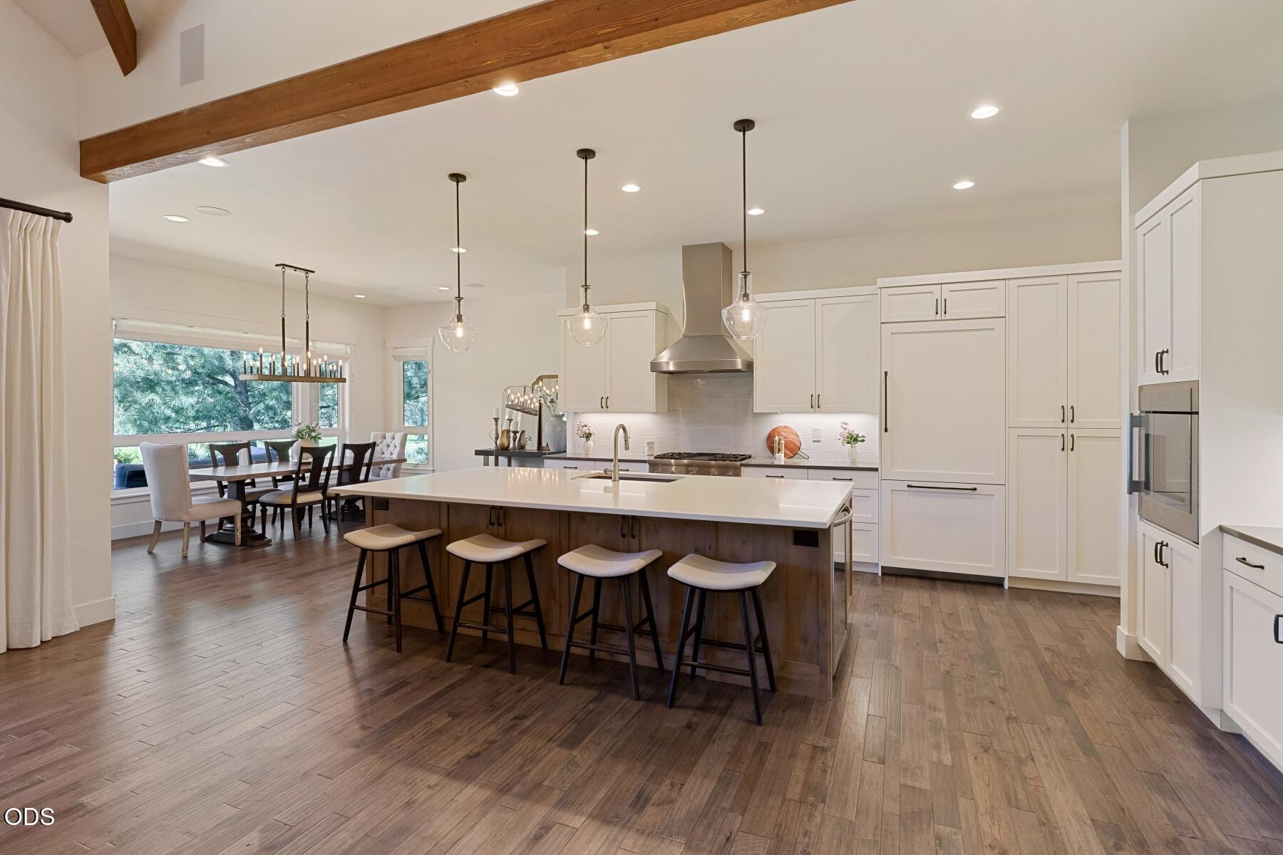 60255 Sunset View Drive Bend, OR 97702 - Photo 11 of 48 a large kitchen with a table and chairs