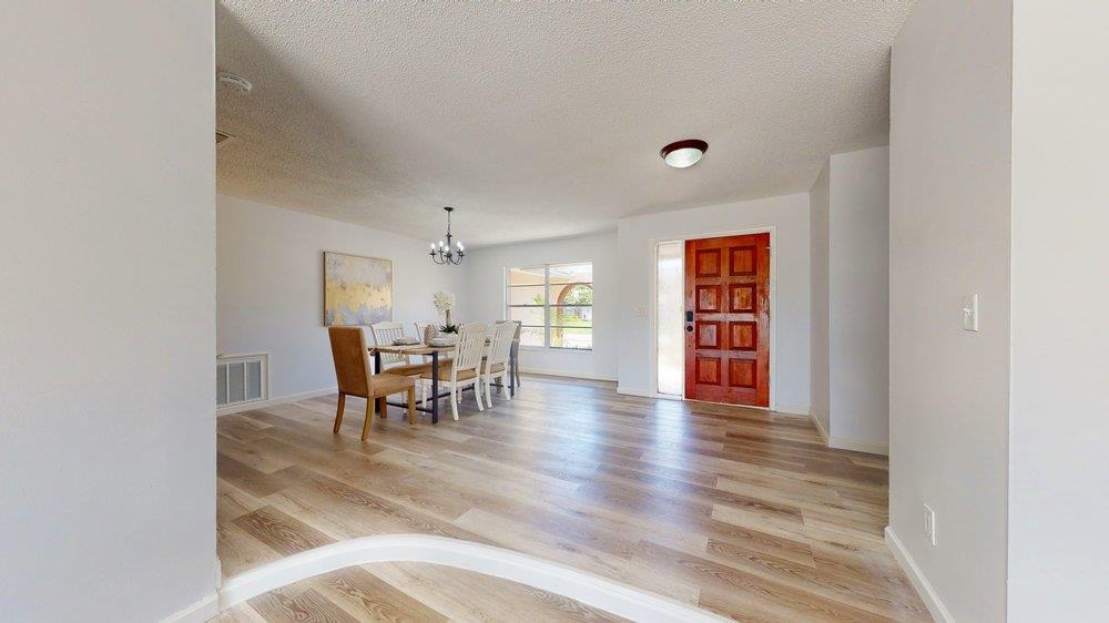 10 Coral Reef Court Palm Coast, FL 32137 - Photo 12 of 44 a dining room with furniture and wooden floor