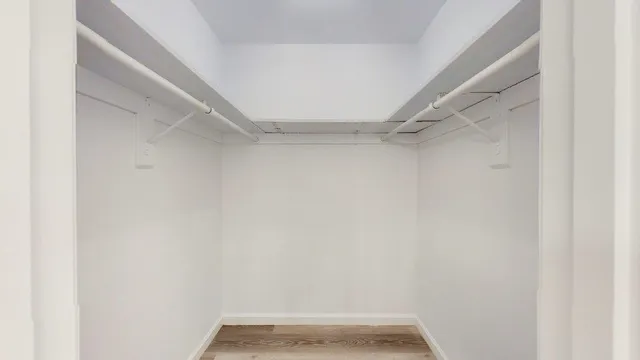 a bedroom with a bed and a table