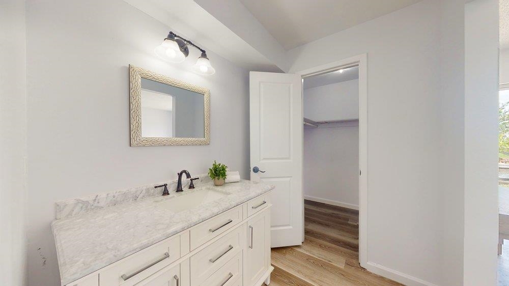 10 Coral Reef Court Palm Coast, FL 32137 - Photo 17 of 44 a bathroom with a double vanity sink and mirror