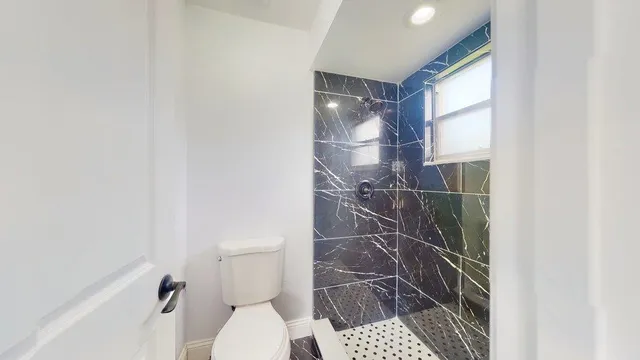 a bathroom with a double vanity sink and mirror