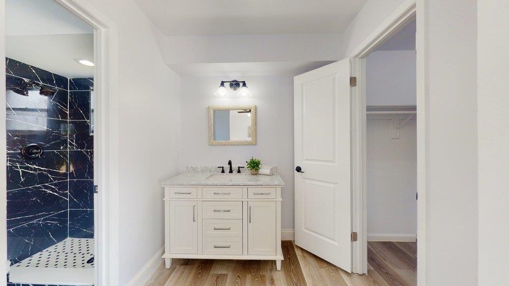 10 Coral Reef Court Palm Coast, FL 32137 - Photo 19 of 44 a room with a walk in closet and wooden floor