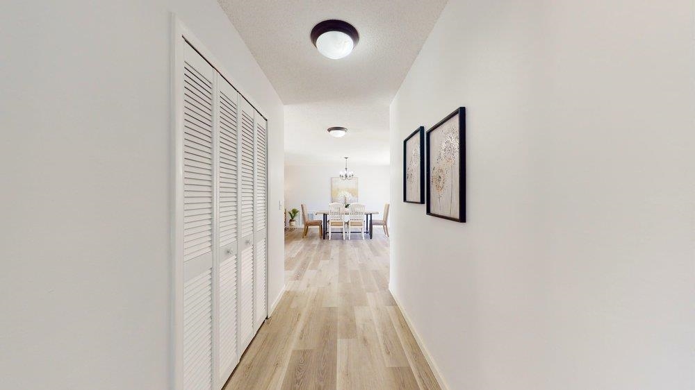 10 Coral Reef Court Palm Coast, FL 32137 - Photo 28 of 44 a view of a hallway with wooden floor and dining room