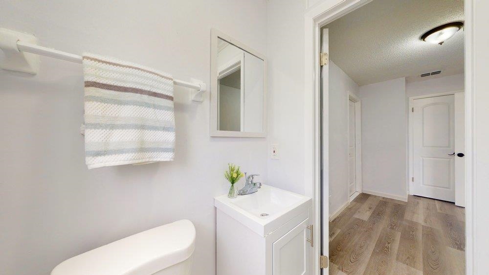 10 Coral Reef Court Palm Coast, FL 32137 - Photo 38 of 44 a white toilet sitting next to a bathroom sink