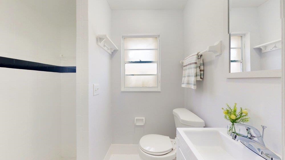 10 Coral Reef Court Palm Coast, FL 32137 - Photo 39 of 44 a white toilet sitting next to a bathroom sink