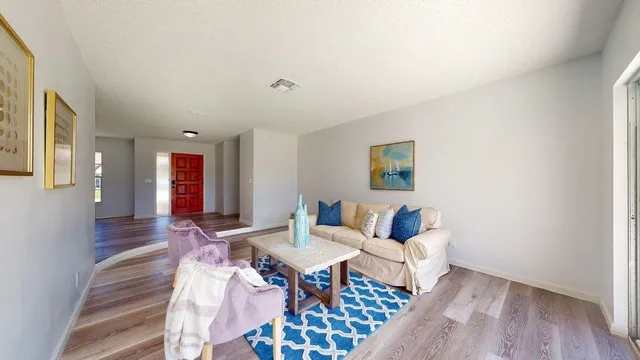 a living room with furniture and a window