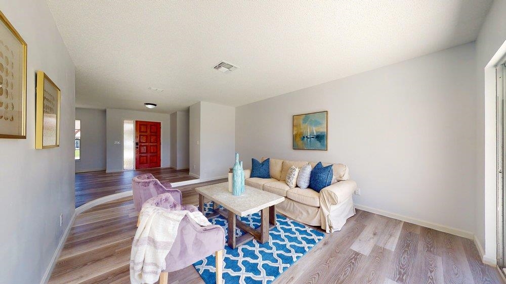 10 Coral Reef Court Palm Coast, FL 32137 - Photo 6 of 44 a living room with furniture and wooden floor