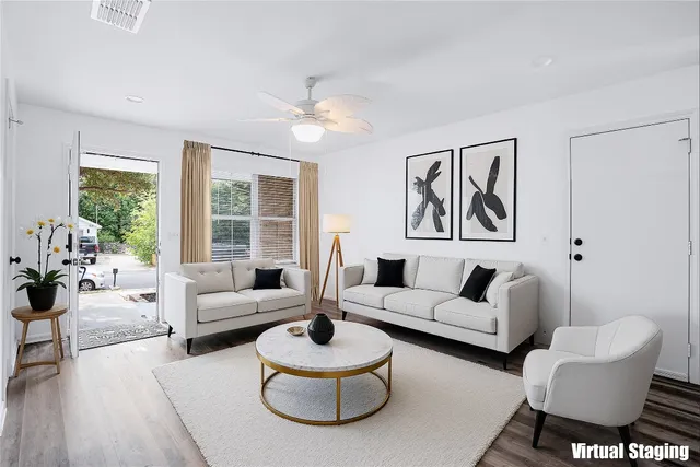 a living room with furniture and a large window