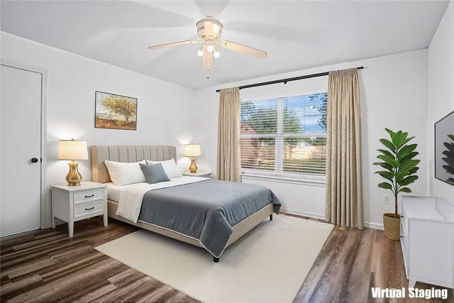 a bedroom with a bed and a window