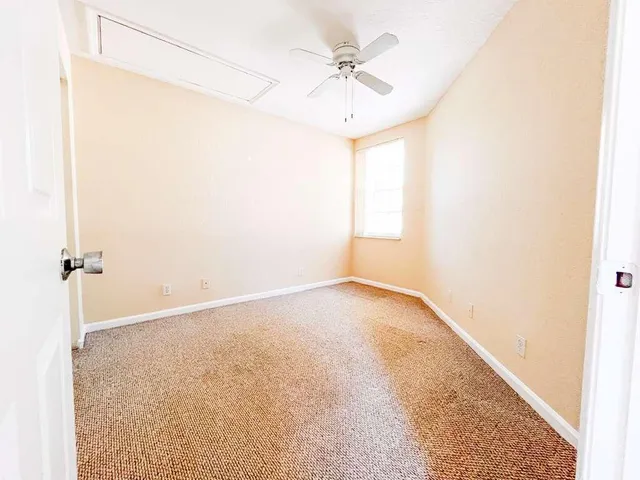 a bathroom with a toilet sink and shower