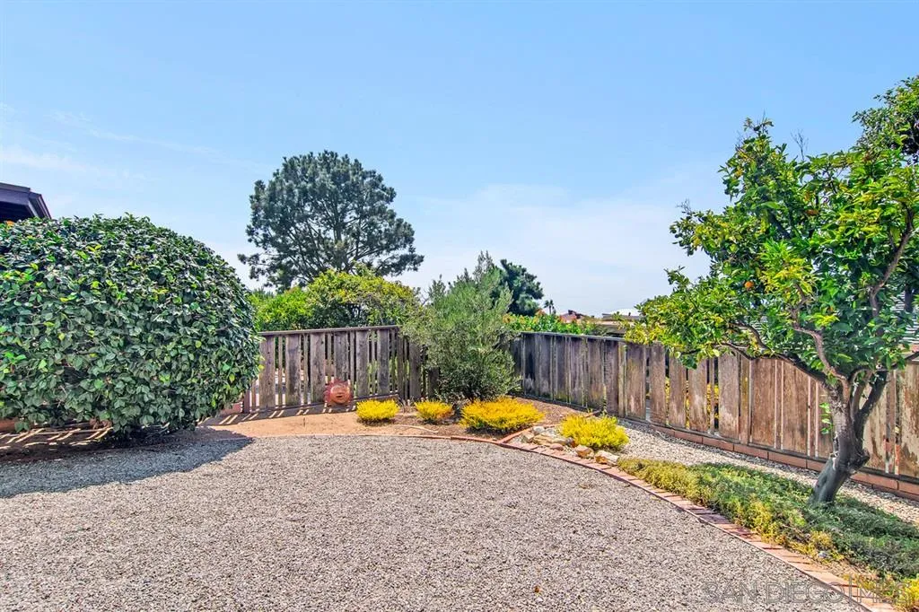 1112 La Jolla Rancho Road La Jolla, CA 92037 - Photo 23 of 25 a view of a swimming pool with a patio and a yard