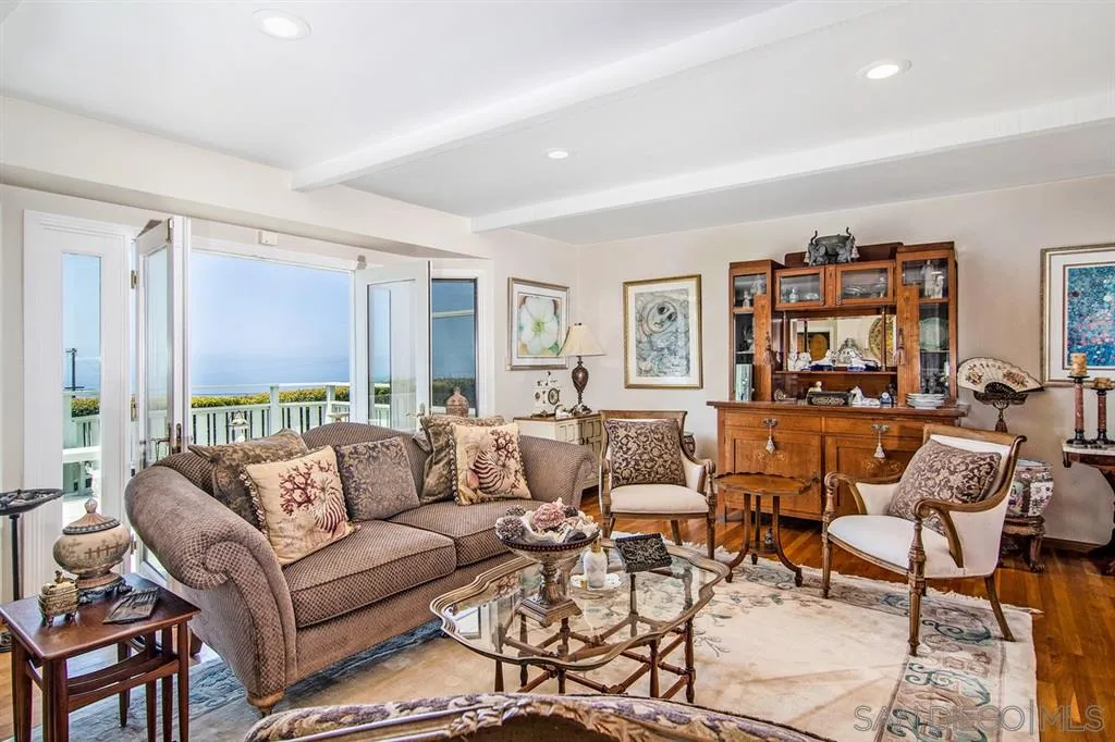 1112 La Jolla Rancho Road La Jolla, CA 92037 - Photo 6 of 25 a living room with furniture and large windows