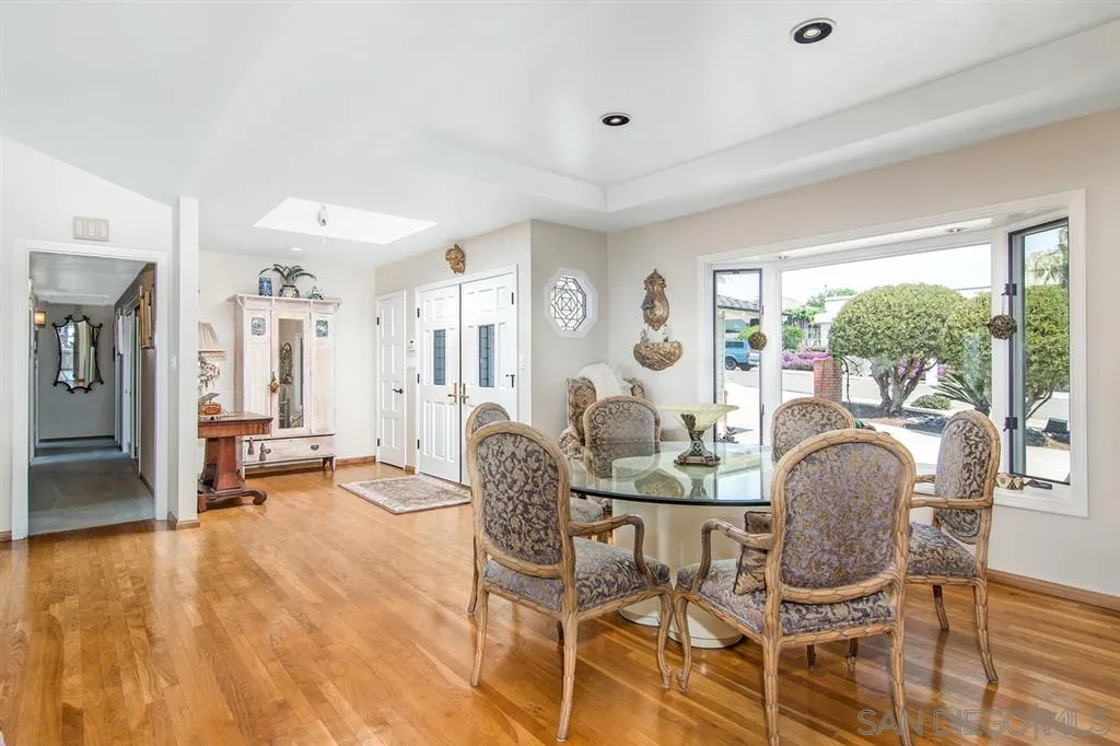 1112 La Jolla Rancho Road La Jolla, CA 92037 - Photo 7 of 25 a dining room with furniture and wooden floor