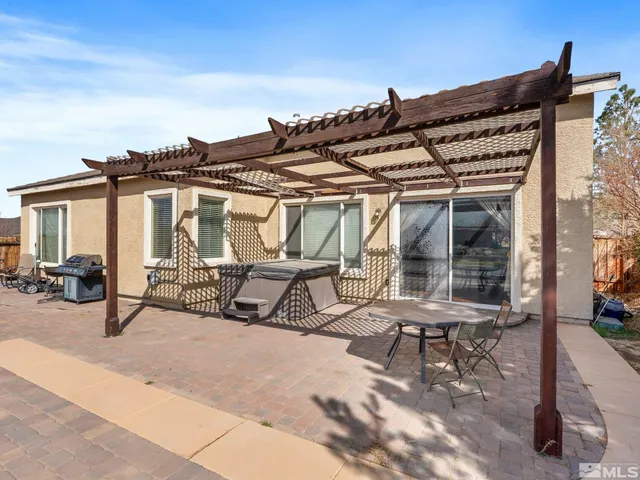 a view of building with car parked