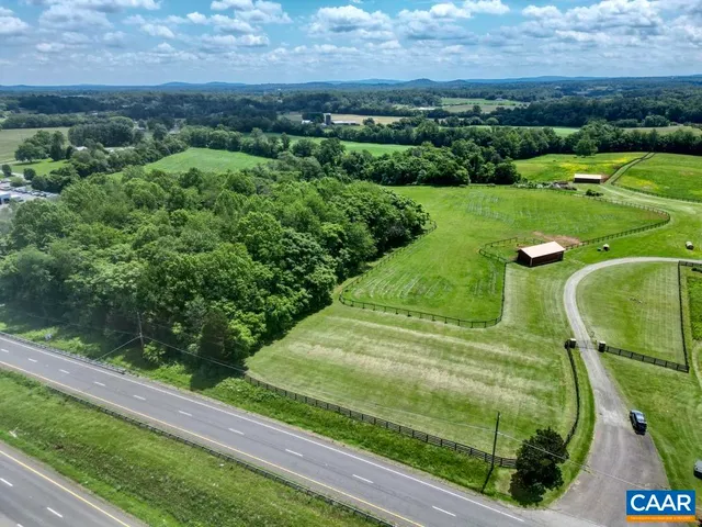 a view of grassy field with trees