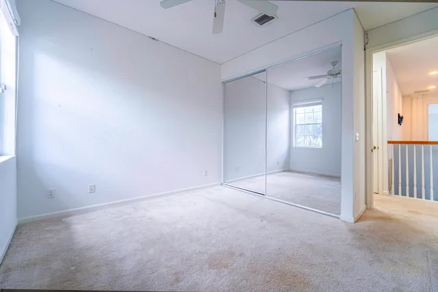 a view of a lake with houses in the back