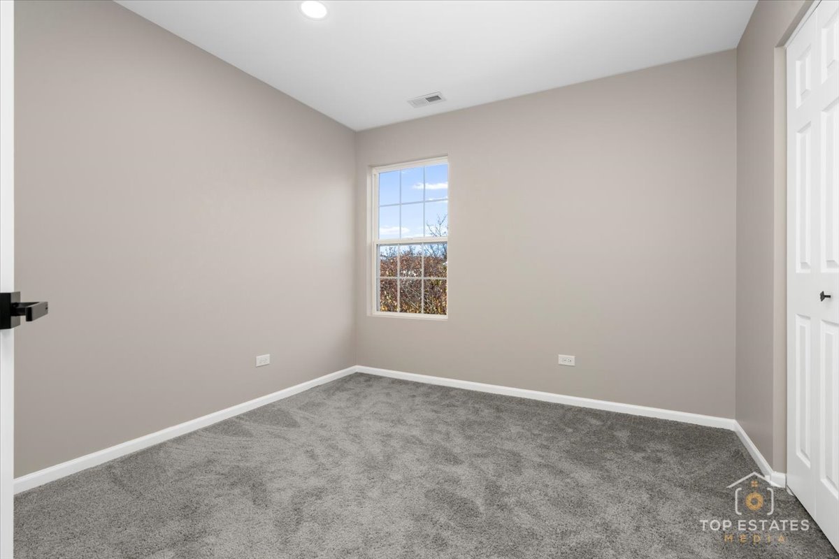 737 Springwood Drive Joliet, IL 60431 - Photo 19 of 31 a view of an empty room with a window