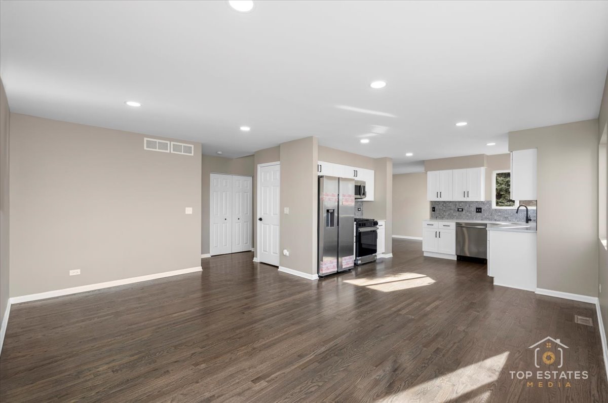 737 Springwood Drive Joliet, IL 60431 - Photo 9 of 31 a view of a kitchen with wooden floor