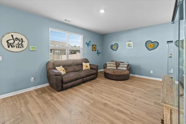 a living room with furniture and a window