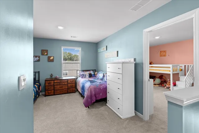 a room with furniture and a flat tv screen