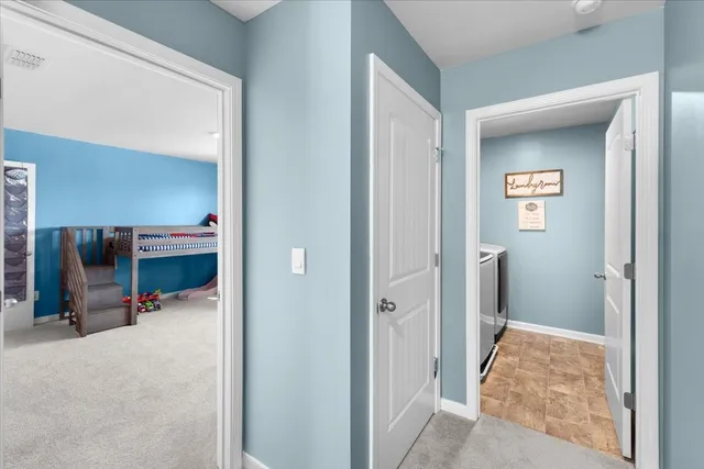 a bedroom with furniture and a flat screen tv