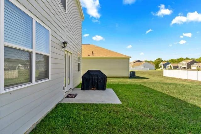 a view of a house with a big yard