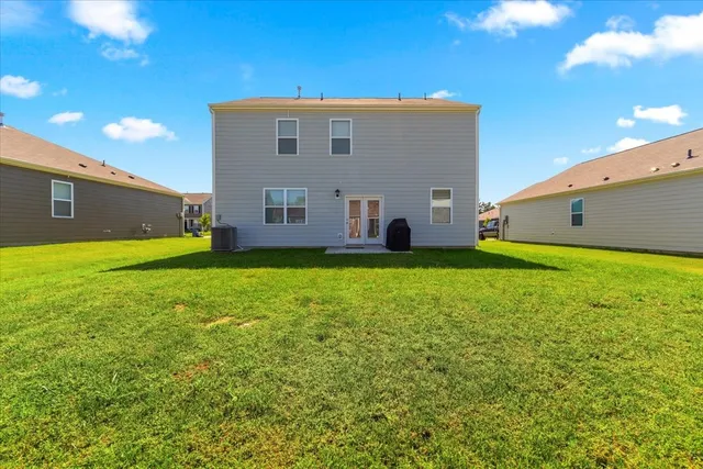 a aerial view of a house with a swimming pool