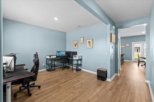 a workspace with furniture and wooden floor