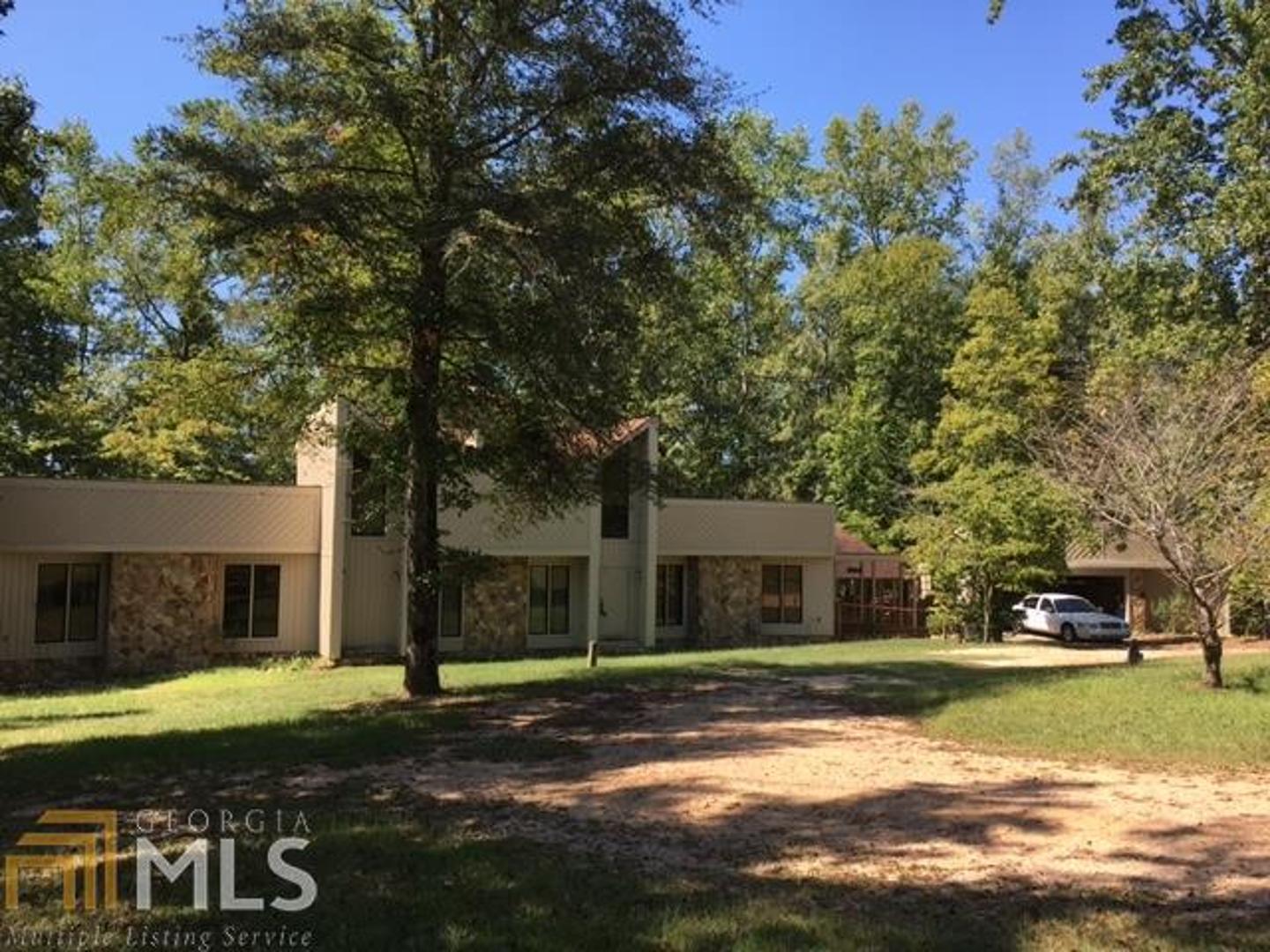 1031 Mt Paran Road, Unit 8 Lizella, GA 31052 - Photo 1 of 1 a view of a house with a yard
