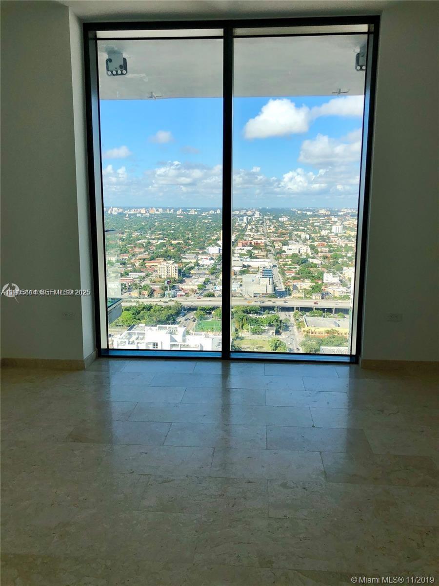88 Southwest 7th Street, Unit 3610 Miami, FL 33130 - Photo 10 of 10 a view of lot of an ocean from a window