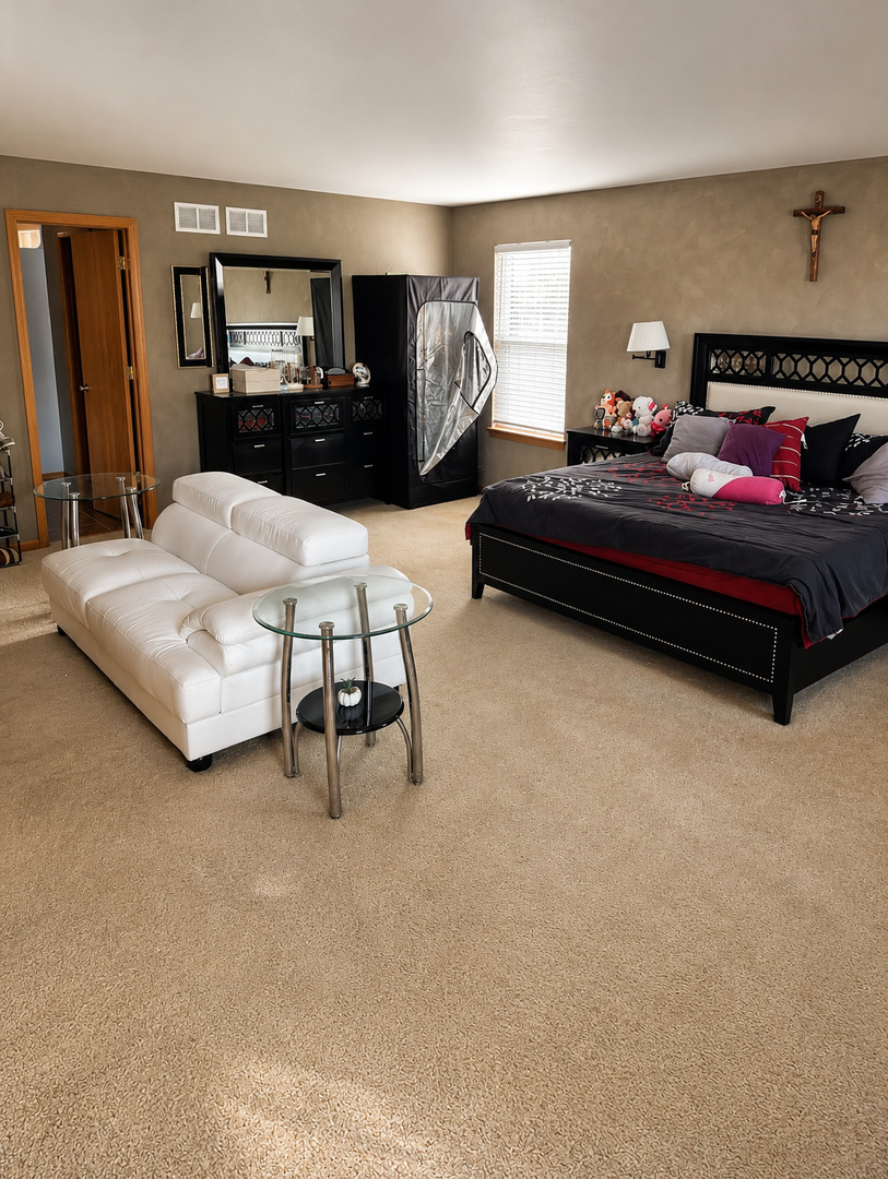720 Ridge Drive Marengo, IL 60152 - Photo 17 of 34 a bedroom with furniture and a couch