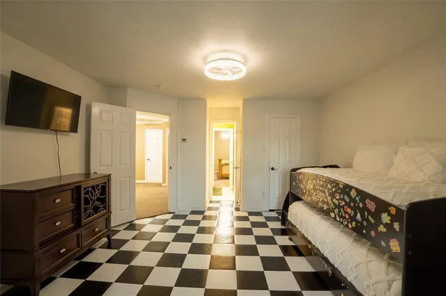 a hallway with a black white checkered floor with a black white checkered floor