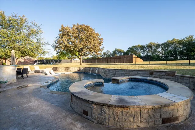 a view of a swimming pool with a patio