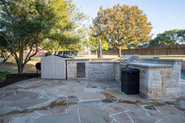 a view of a house with a tub and trees