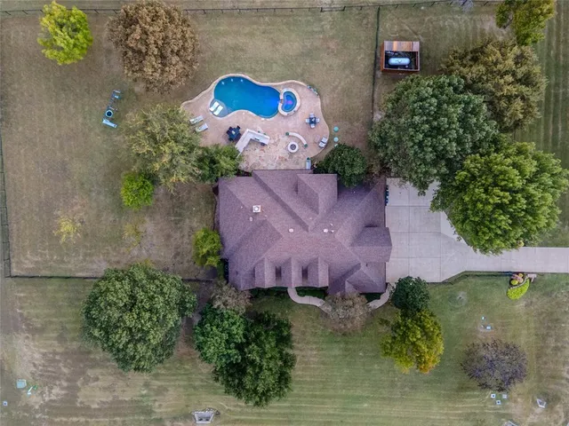 an aerial view of a house with a garden
