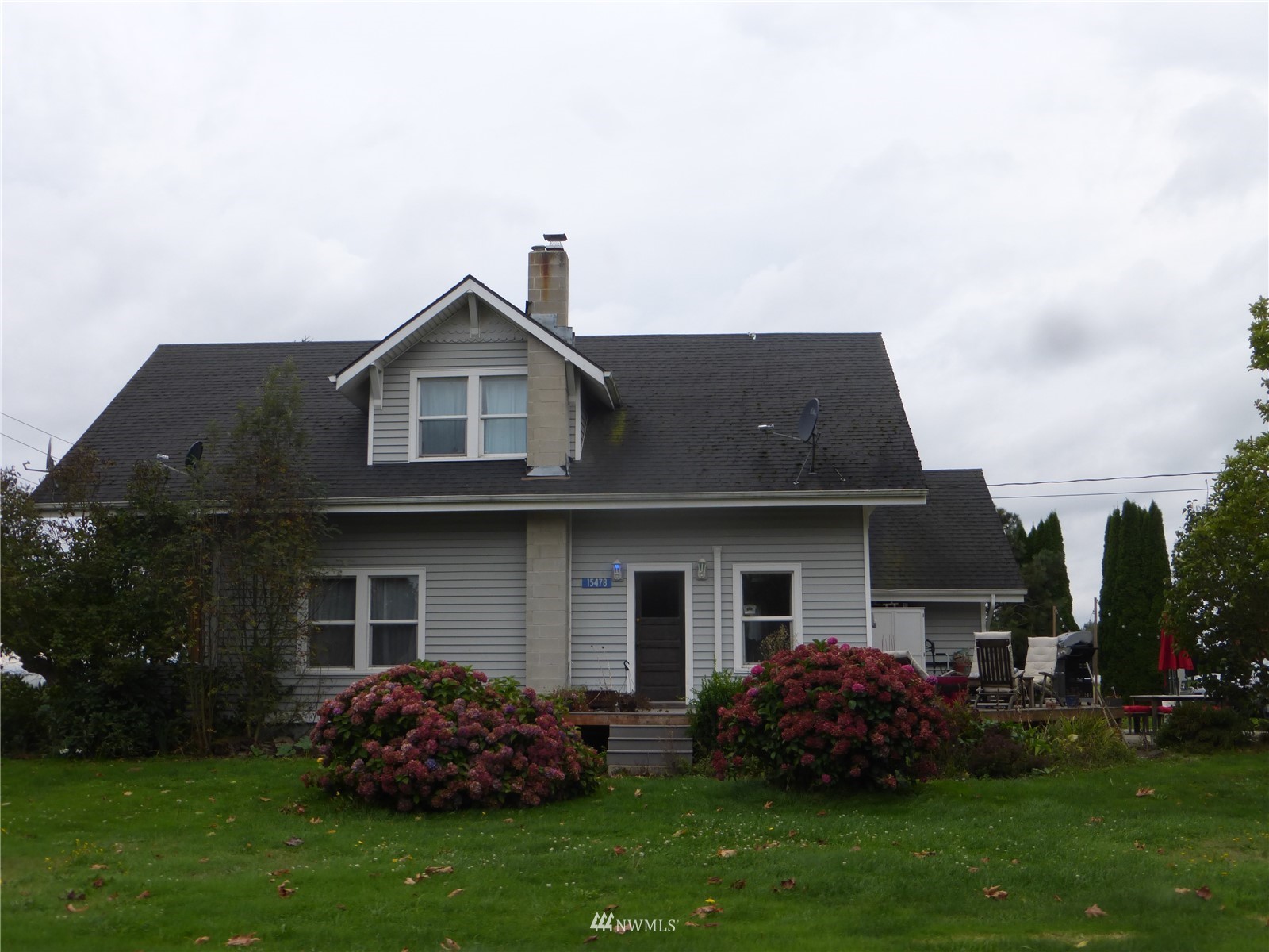 a front view of house with garden