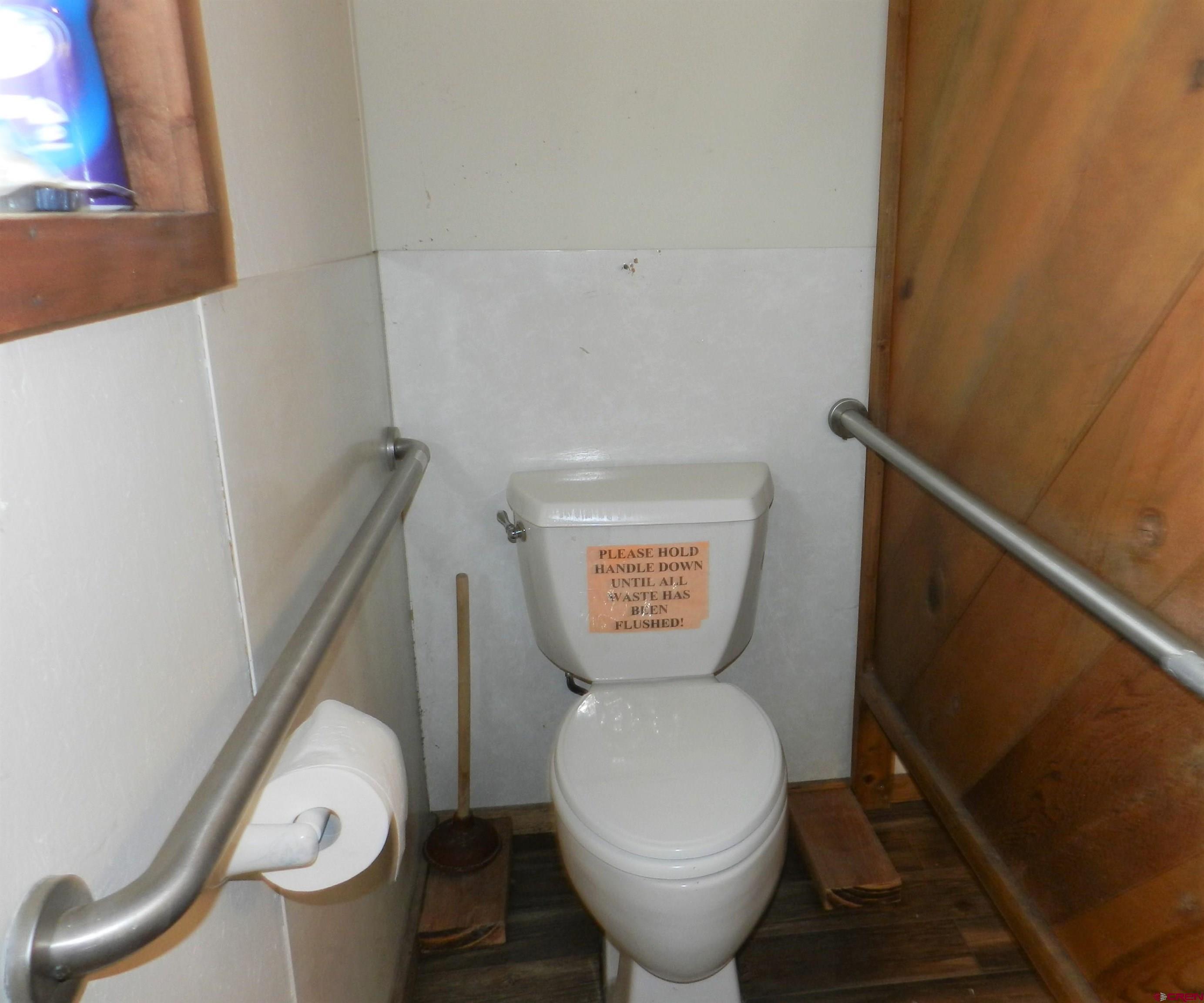 17656 Highway 550, Unit I1 Montrose, CO 81403 - Photo 18 of 18 a bathroom with a toilet and a sink