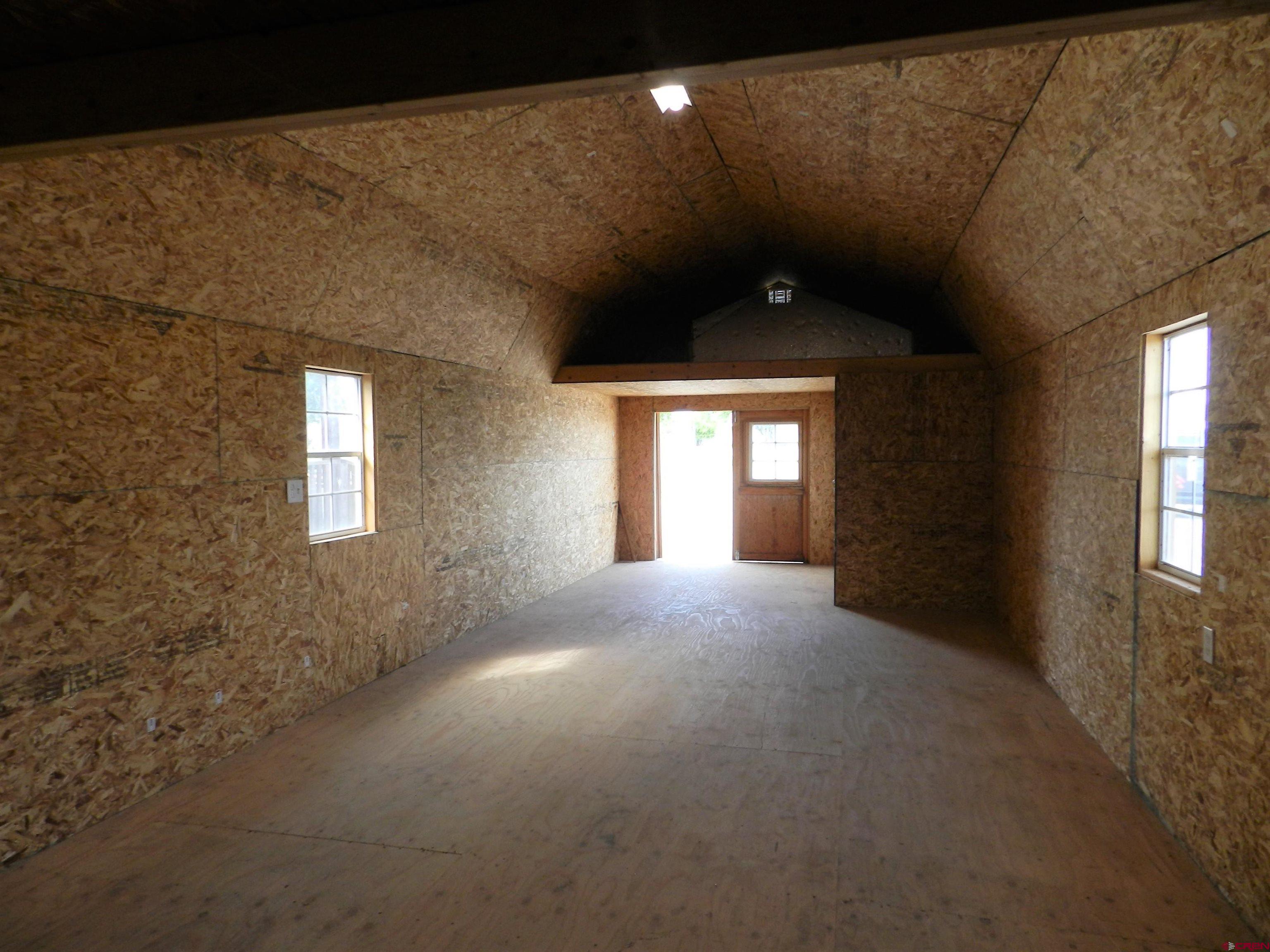 17656 Highway 550, Unit I1 Montrose, CO 81403 - Photo 5 of 18 a view of empty room with windows