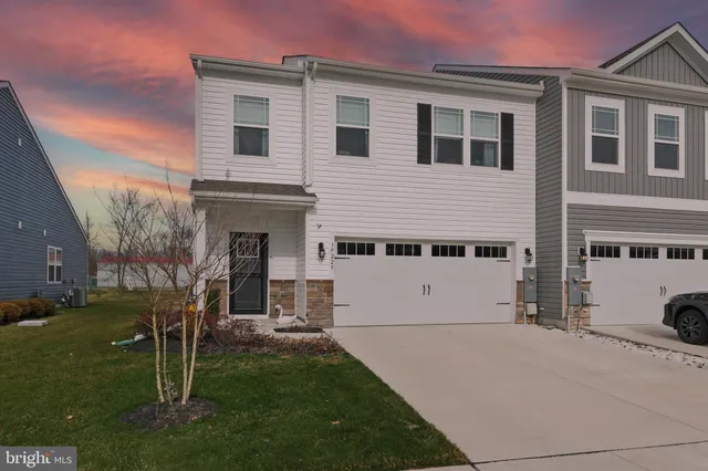 a view of house with yard