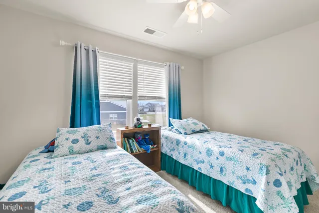 a bedroom with a bed and a view of bathroom