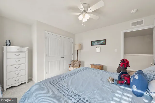 a bedroom with a bed and a closet