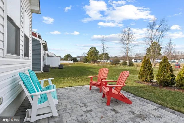 a backyard of a house with outdoor seating