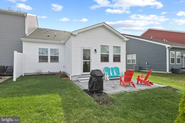 a backyard of a house with seating space
