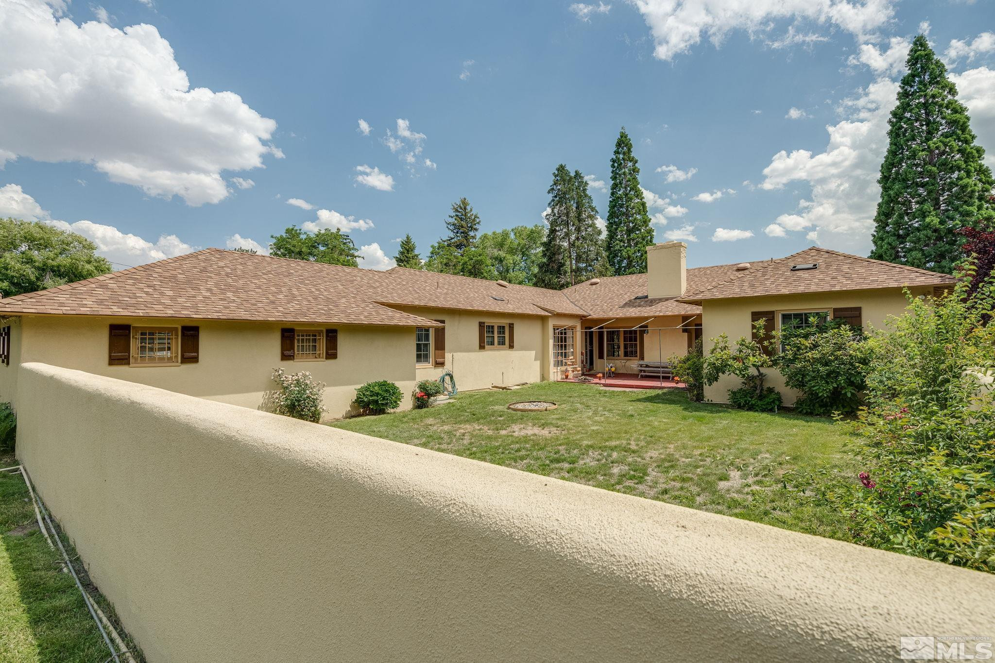 333 Urban Road Reno, NV 89509 - Photo 3 of 40 a front view of a house with a garden