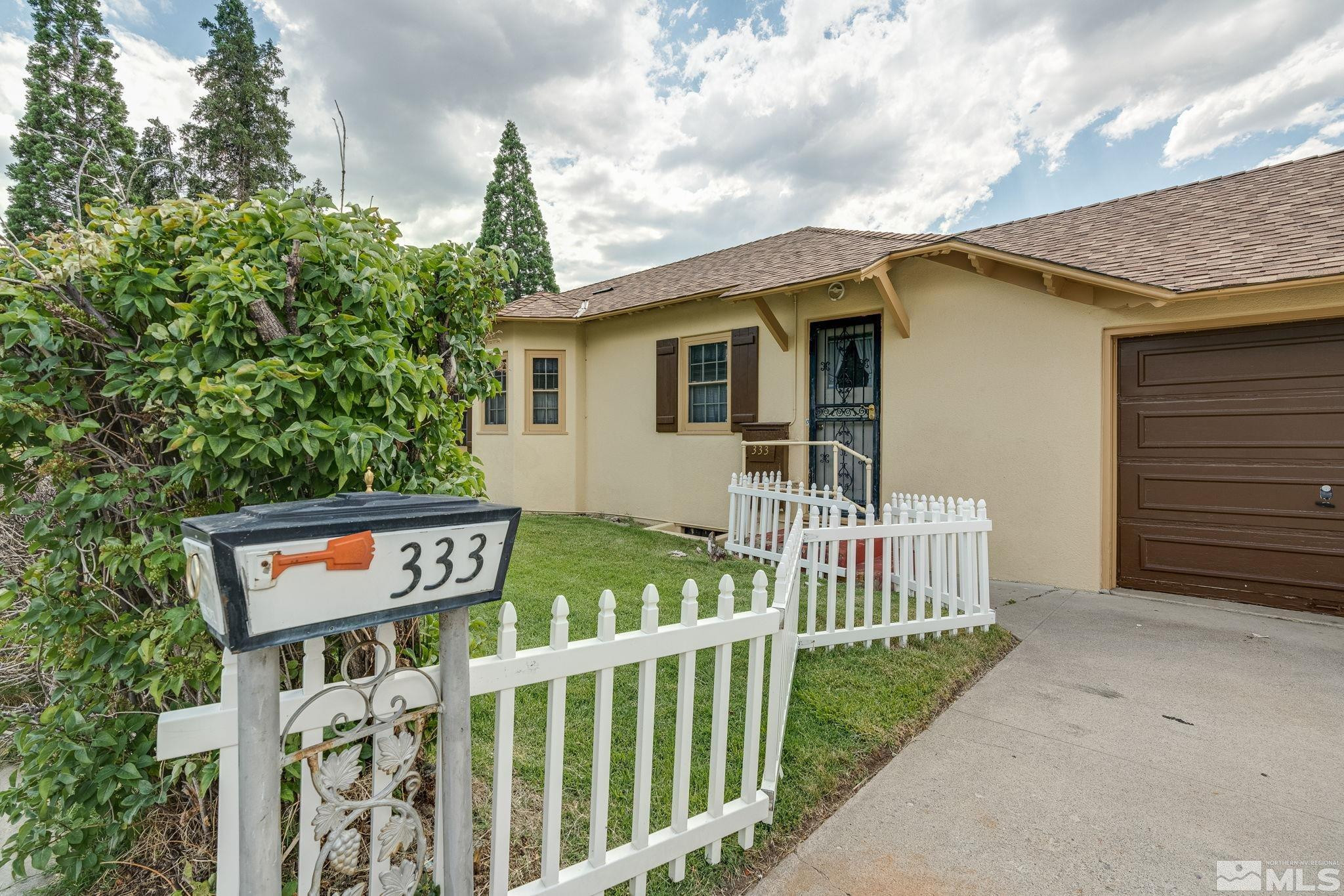 333 Urban Road Reno, NV 89509 - Photo 5 of 40 a front view of a house with garden