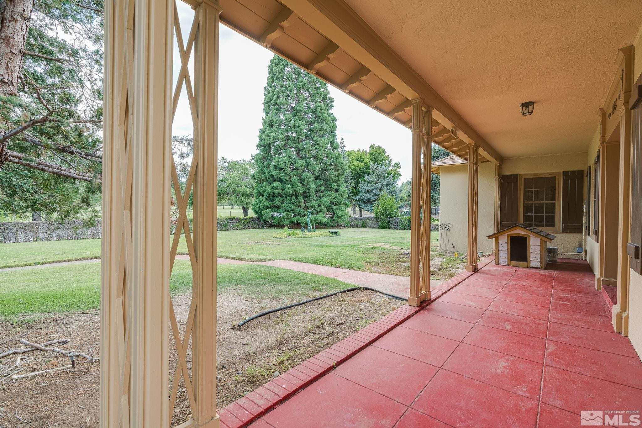 333 Urban Road Reno, NV 89509 - Photo 8 of 40 a view of a porch with a floor to ceiling window and a yard