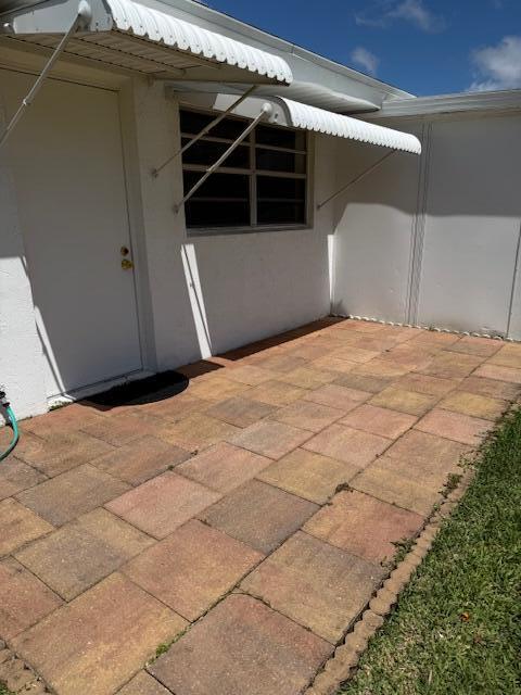 322 Colony Lane, Unit C Fort Pierce, FL 34982 - Photo 17 of 25 Open paver patio