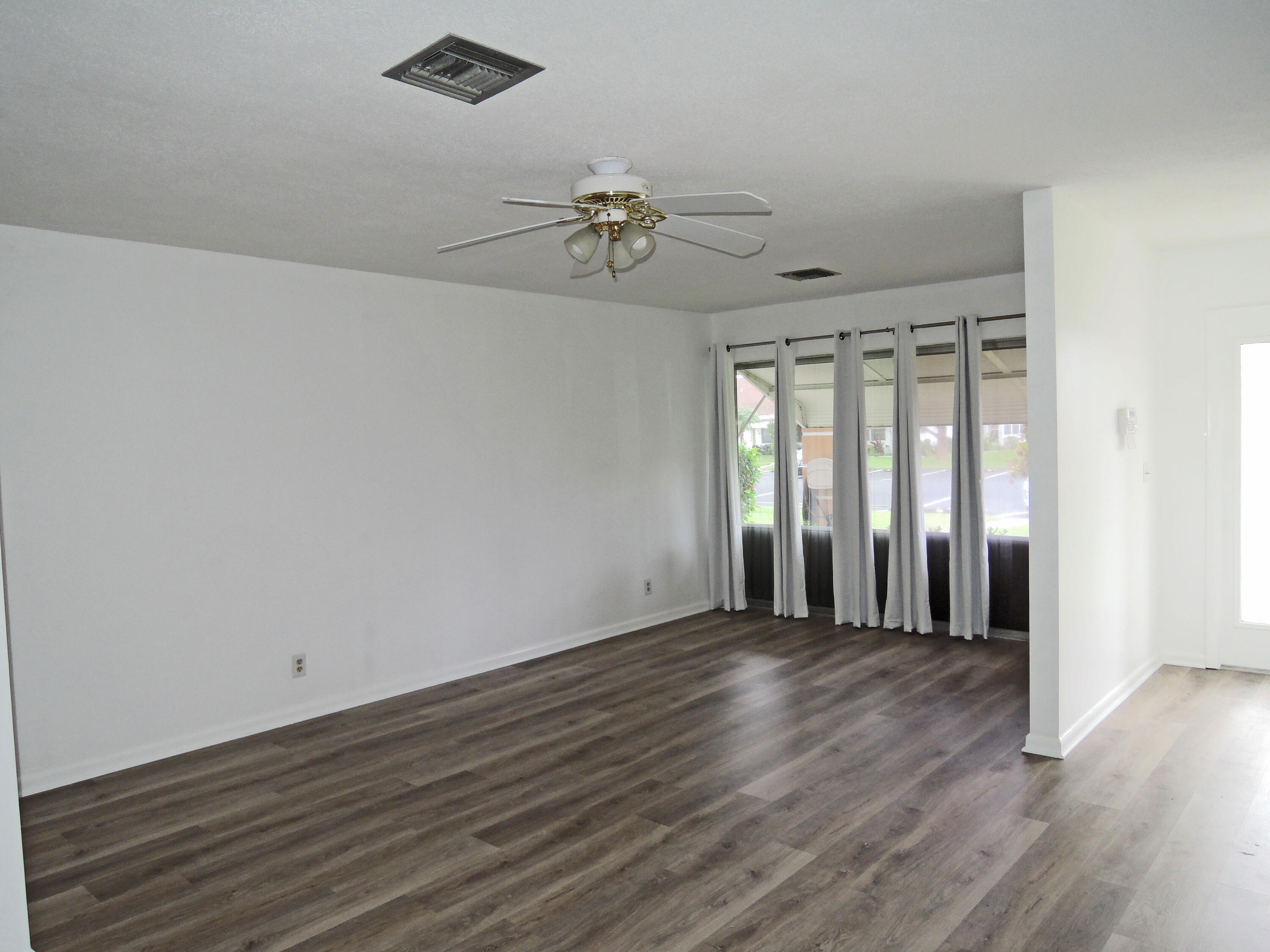 322 Colony Lane, Unit C Fort Pierce, FL 34982 - Photo 5 of 25 Living RM & Front Entrance